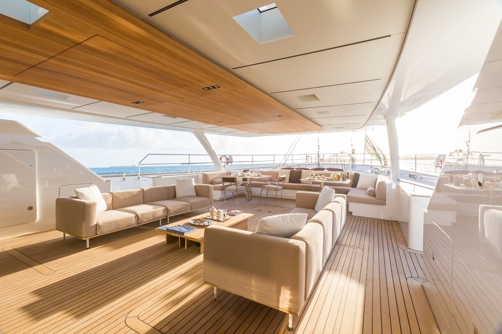 Yacht teak deck with sofas and cushions