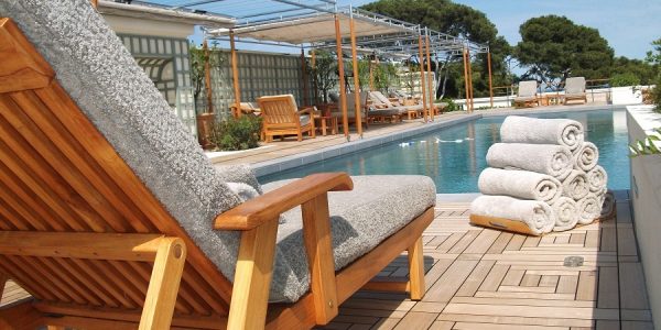 Deck chair by pool with High-End Teak Deck
