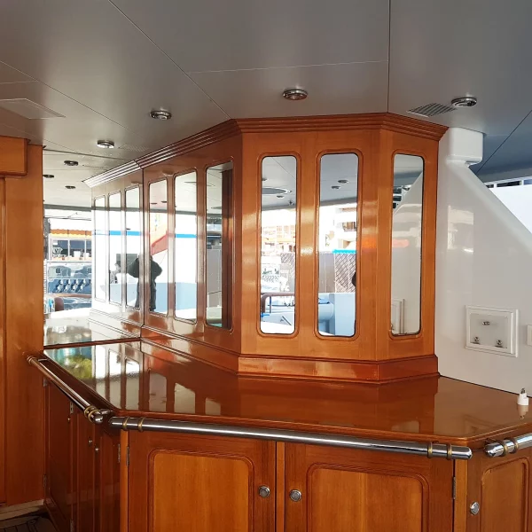 The interior of a yacht with a fresh cabinet made of wood